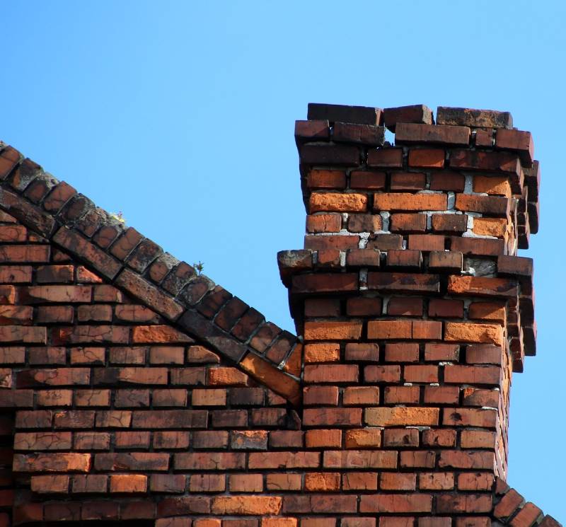 Signs Your Crest Hill Home Needs a Chimney Inspection Damaged chimney on an Crest Hill home showing cracks and missing mortar
